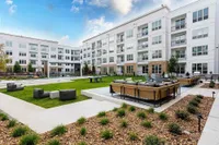 Modern apartment complex featurOutdoor seating | Caroline at Memorial | Houston, Texas