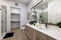 Contemporary design meets everyday function in this double vanity bathroom.