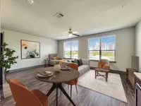 Chic urban apartment living room with modern decor, large windows, and city skyline views.