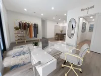 East Austin Apartments | Apartments in Austin | New apartments in Austin |Chic boutique interior with stylish clothing rack, contemporary desk setup, and modern decor, offering a bright, inviting atmosphere.