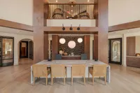 Luxurious office space with elegant decor, stylish wooden accents, and modern lighting, perfect for a productive work environment.