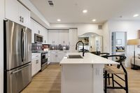 Two Bedroom Kitchen and Living | Caroline Georgetown, Georgetown, TX Apartments