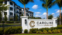 Luxurious Caroline Pompano Beach apartments surrounded by lush greenery and elegant palm trees, offering modern living in a serene setting.