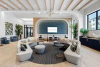 Elegant and modern lounge area with sleek furniture, stylish decor, and abundant natural light, offering a luxurious and inviting atmosphere.