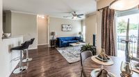 Apartment dining area with adjacent kitchen at Bennett Baytown