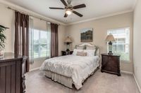 Apartment bedroom with large windows at Bennett Baytown