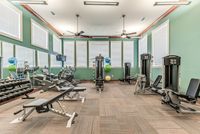 Community fitness center with cardio equipment, strength machines, and free weights
