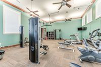 Community fitness center with strength equipment, cardio machines, and exercise accessories
