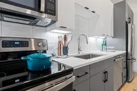 Self-Cleaning Ovens with Ceramic Glass Tops Modern Kitchen | Plano TX Apartment For Rent | The Emory