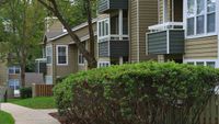 Apartment Home Exteriors with lush landscaping at Autumn Columbia apartments.