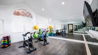 Cutting Edge Fitness Center with Floor to Ceiling Mirrors at Alister Galleria apartments.