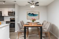 Modern Kitchen featuring Stainless Steel Appliances and separate dining area at AutumnTown Center Columbia apartments.