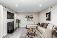 Cozy two-bedroom home with fireplace and upgraded design Countertops and White Cabinetry at Autumn Town Center Columbia apartments.