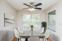 Spacious Dining Room next to Open Concept Kitchen in an Autumn Town Center apartment.