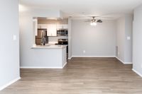 Luxurious Kitchen with Upgraded Stainless Appliances in an Autumn Town Center apartment.