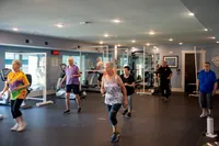 Residents Exercising in the Fitness Center | Attivo Trails Waukee | Waukee, Iowa
