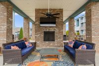 outdoor seating beside the firepit and tv