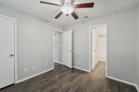 spacious bedroom with ceiling fans