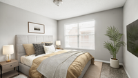 Carpeted bedroom with queen-size with gray fabric framing, flat screen TV, end table table lamp