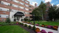 Apartment community in Bryn Mawr with tree‑lined surroundings and ample parking