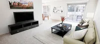 Living room in 1-bedroom unit at Woodmere Apartments