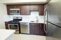 Kitchen interior with large pantry at Woodmere Apartments