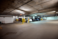 Well-maintained onsite parking lot with garage parking for residents at a 55+ community on the Main Line in Philadelphia.