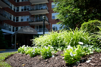 Beautifully maintained landscaping with lush greenery and courtyards at a 55+ apartment complex on the Main Line in Philadelphia