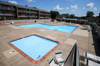 Relaxing poolside at Woodmere Apartments
