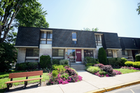 Summit Park apartment buildings surrounded by trees and greenery