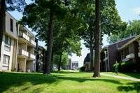 Exterior view of Summit Park Apartments with landscaped grounds