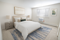 Bright and cozy bedroom with elegant decor, featuring a plush bed, stylish lamps, and a serene ambiance.