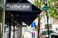 Charming urban street with a vibrant bar and game venue, perfect for entertainment and socializing.