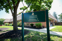 Charming view of Delaire Landing with lush landscaping and inviting pathways.
