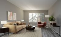 Chic living room with contemporary furniture, natural light, and elegant decor, featuring a comfortable sofa and stylish armchair.