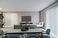 Modern open-concept living room with sleek furniture, natural light filtering through large vertical blinds, and elegant dining area.