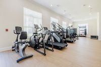 Bright and modern gym with state-of-the-art cardio machines and a spacious layout for a premium workout experience.