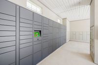 Modern package delivery room featuring sleek, secure lockers and natural lighting, ideal for convenient living.