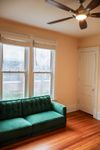 Living Room at bottom floor unit at 1114 Mound St comes with in-unit washer and dryer
