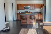Kitchen and Breakfast Bar in 4BR/2BA Apartment.