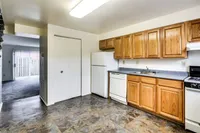 Modern kitchen showcasing a refrigerator, stove, and microwave at Bright Meadows Townhomes.