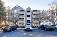 Exterior view of Allyson Gardens Apartments II, located at the street corner with a spacious parking lot nearby.