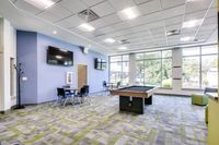 Clubhouse featuring cozy seating and vibrant decor in Butler Ridge Apartments.