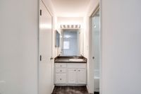 Neat bathroom displaying a sink and toilet, situated in Allyson Gardens Apartments II.