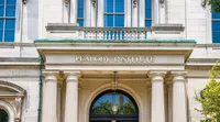 Elegant architectural facade of Peabody Institute with classical columns and intricate detailing.