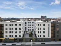 Modern urban apartment complex with sleek design and rooftop views, offering stylish living in a vibrant cityscape.
