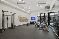 Modern fitness center with state-of-the-art equipment, bright lighting, and welcoming decor, ideal for an energizing workout.