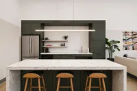 Modern kitchen featuring sleek cabinetry, elegant countertop, and stylish bar stools with open shelving and artistic decor.