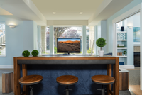 Cozy and modern living area featuring stylish bar stools, a sleek bar counter, and a large window offering scenic views.