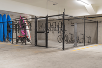 Secure apartment storage featuring bike racks and vibrant kayaks, ideal for outdoor enthusiasts.